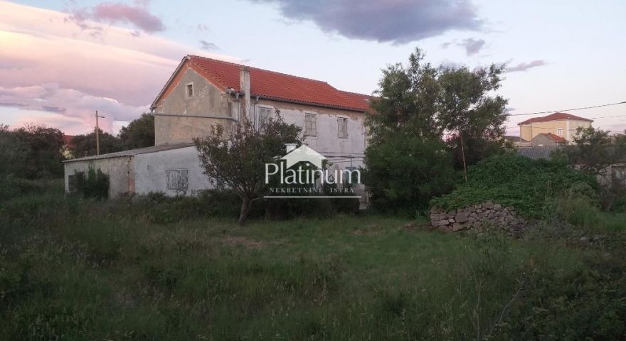 Olib, casa a schiera su un Olib, casa a schiera su un